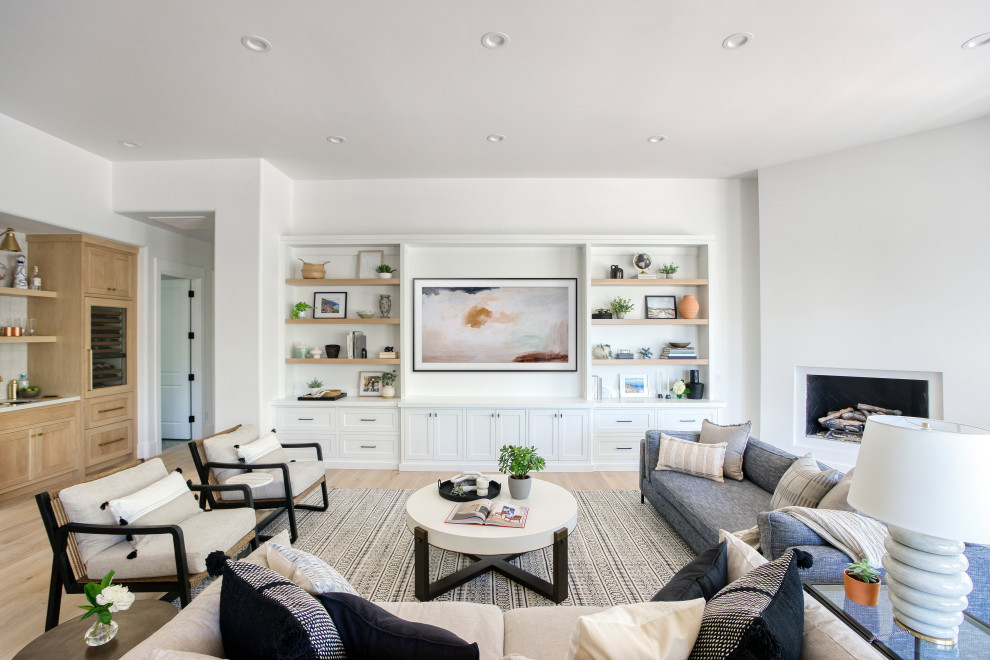 Transitional open concept light wood floor family room photo in Phoenix with a bar and a media wall