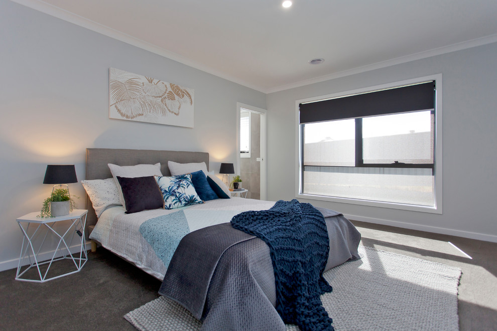 Mid-sized transitional master bedroom in Other with carpet, grey floor and blue walls.