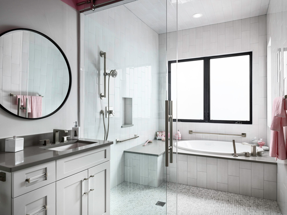Inspiration for a contemporary wet room bathroom in Denver with shaker cabinets, grey cabinets, a drop-in tub, white tile, mosaic tile floors, an undermount sink, white floor, grey benchtops, a niche and a single vanity.