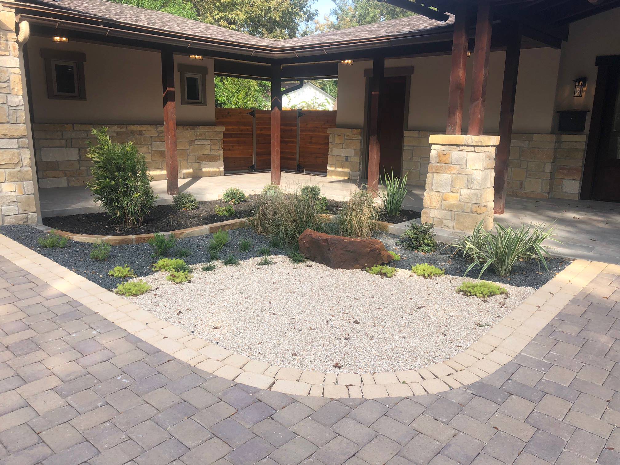 Xeriscape entryway using a combination of aggregates and mulch