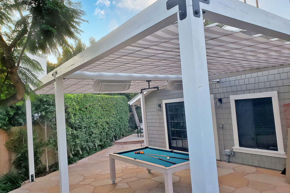 Design ideas for a medium sized contemporary back patio in Santa Barbara with natural stone paving and a pergola.