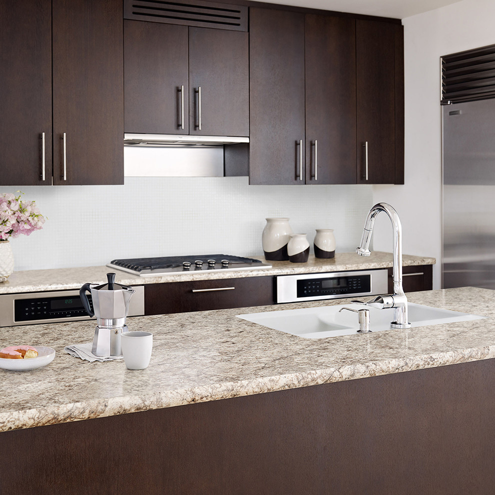 This is an example of a contemporary kitchen in Austin with a drop-in sink.