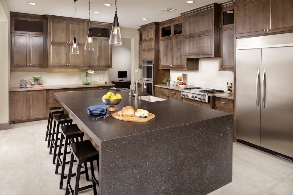 Eat-in kitchen - modern l-shaped ceramic tile eat-in kitchen idea in Houston with flat-panel cabinets, gray cabinets, stainless steel appliances, an island, a farmhouse sink and quartz countertops