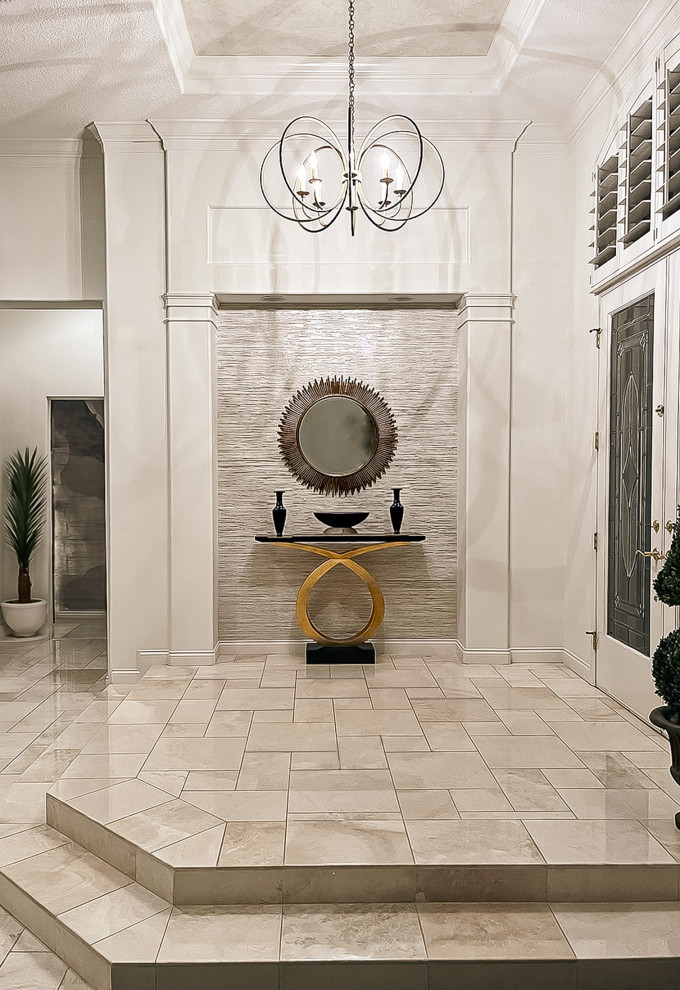 This is an example of an eclectic foyer in Orlando with white walls, travertine flooring, a double front door, a drop ceiling and wallpapered walls.