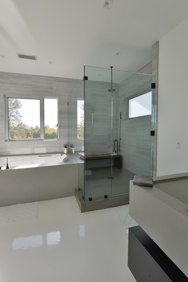 Inspiration for a large modern master bathroom in Los Angeles with open cabinets, black cabinets, a hot tub, an alcove shower, grey walls, a trough sink and solid surface benchtops.