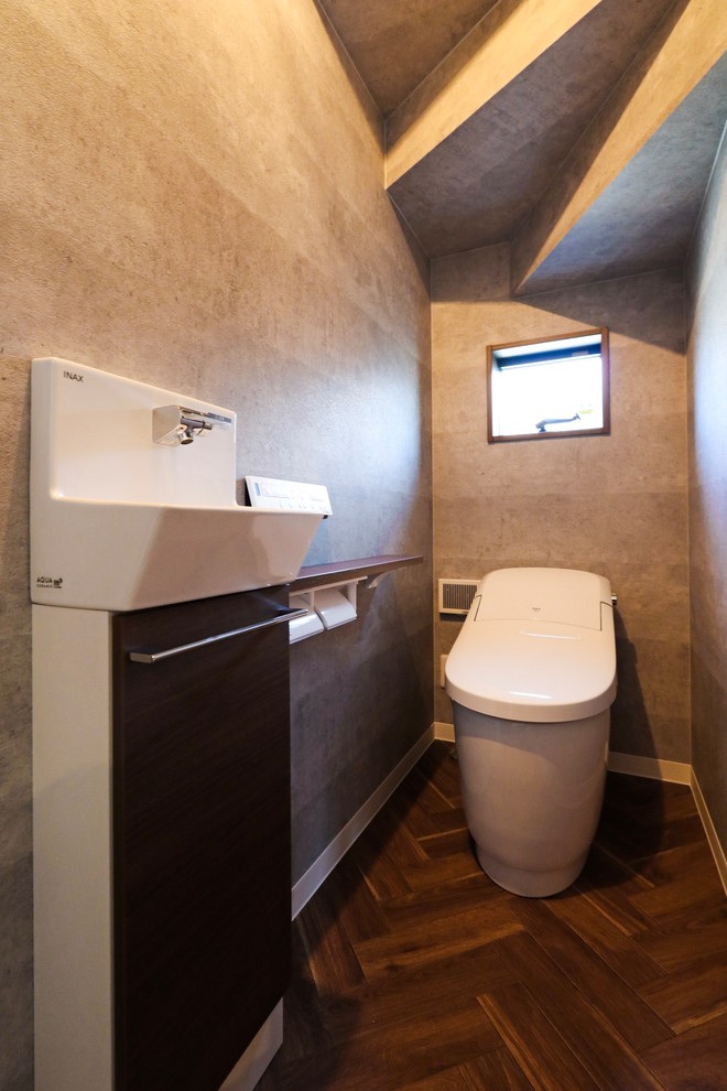 Photo of an industrial powder room in Other with grey walls.
