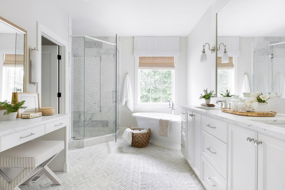 Design ideas for a large beach style master bathroom in Minneapolis with beaded inset cabinets, white cabinets, a freestanding tub, a corner shower, white tile, white walls, mosaic tile floors, engineered quartz benchtops, white floor, a hinged shower door, white benchtops and an undermount sink.