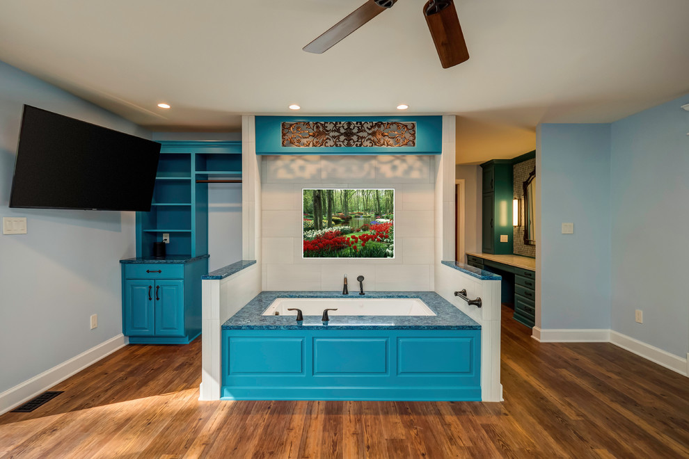 Inspiration for a large traditional master bathroom in Other with recessed-panel cabinets, turquoise cabinets, an alcove tub, blue tile, ceramic tile, medium hardwood floors, engineered quartz benchtops, brown floor, blue benchtops and grey walls.