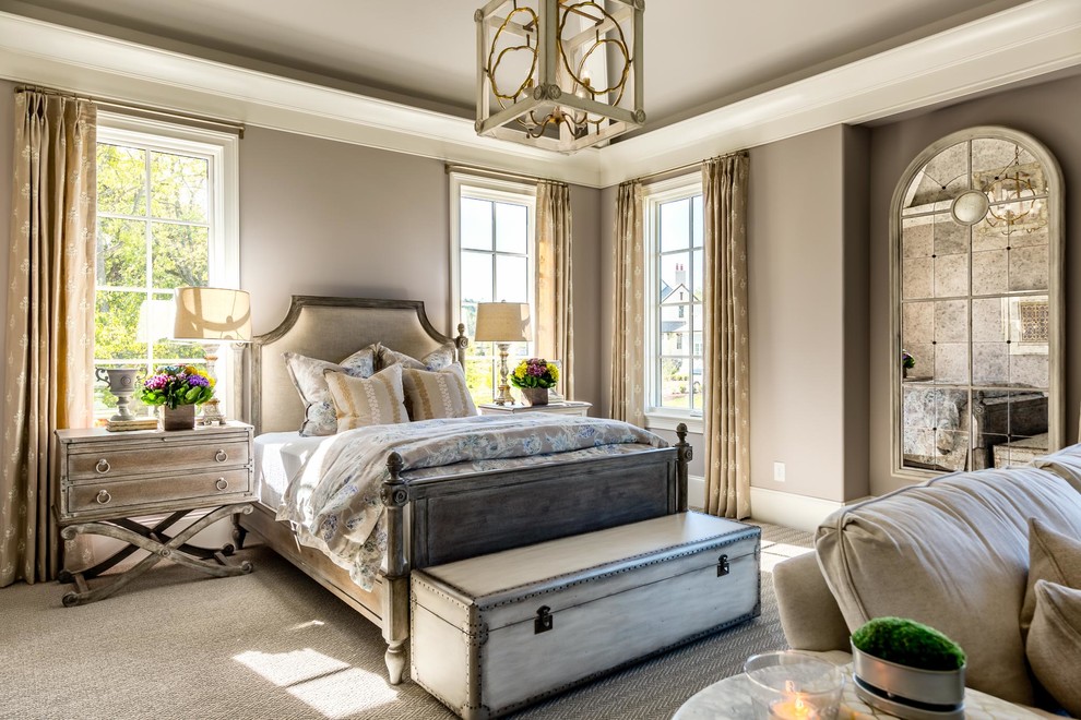 Large traditional guest bedroom in Nashville with beige walls, carpet and beige floor.