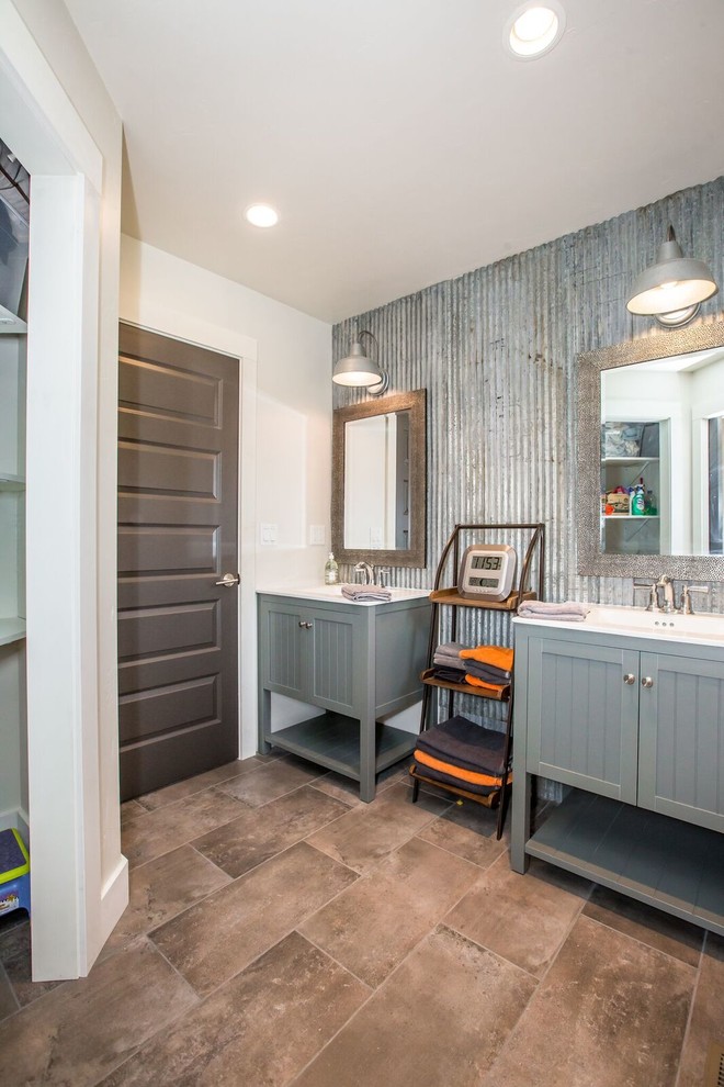 Mid-sized industrial master bathroom in Other with shaker cabinets, grey cabinets, gray tile, metal tile, white walls, ceramic floors, an integrated sink and brown floor.