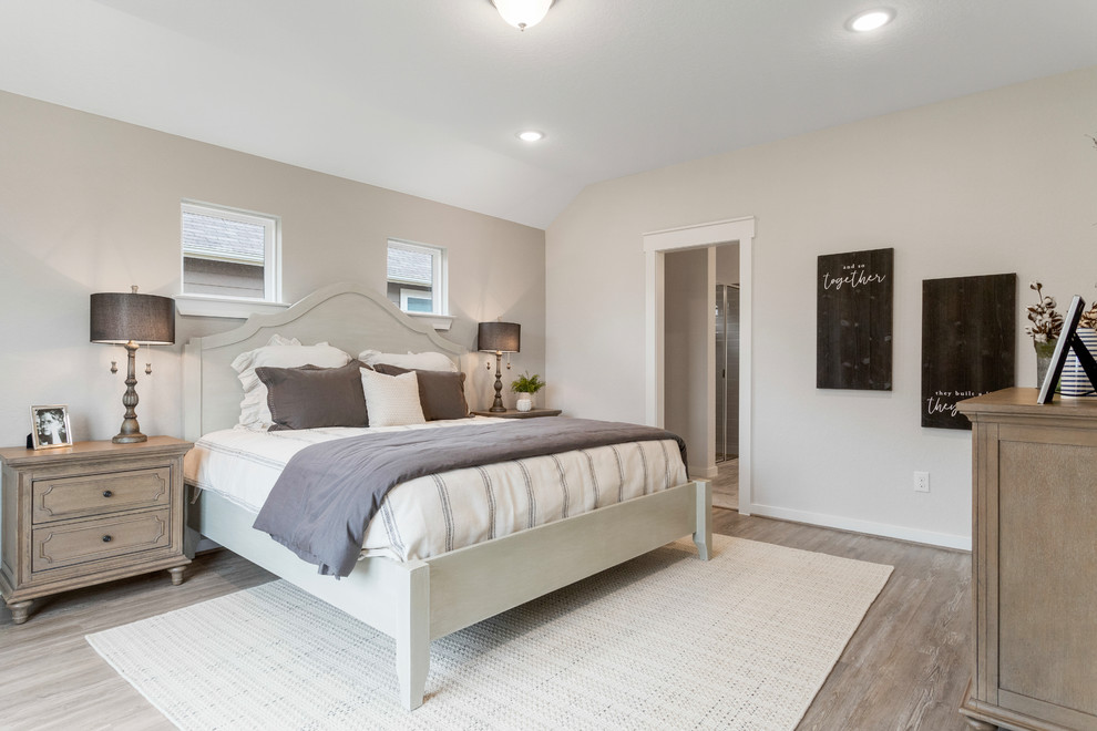 Mid-sized contemporary master bedroom in Other with beige walls, light hardwood floors and beige floor.