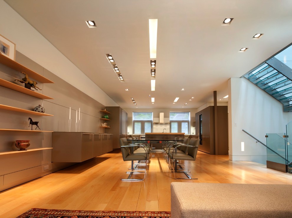 Design ideas for a large contemporary kitchen/dining combo in Philadelphia with white walls, light hardwood floors and no fireplace.