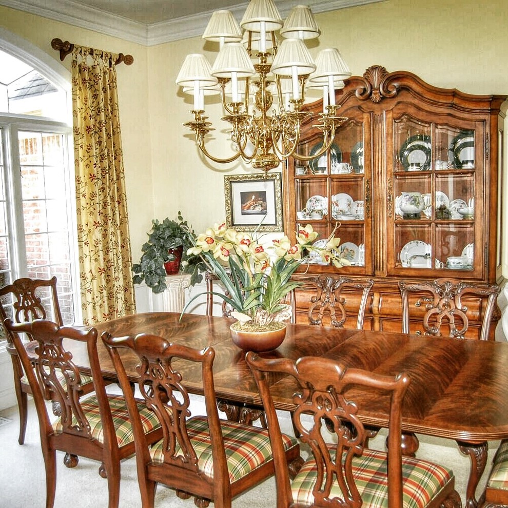 Large traditional separate dining room in Indianapolis with yellow walls, carpet, no fireplace and white floor.