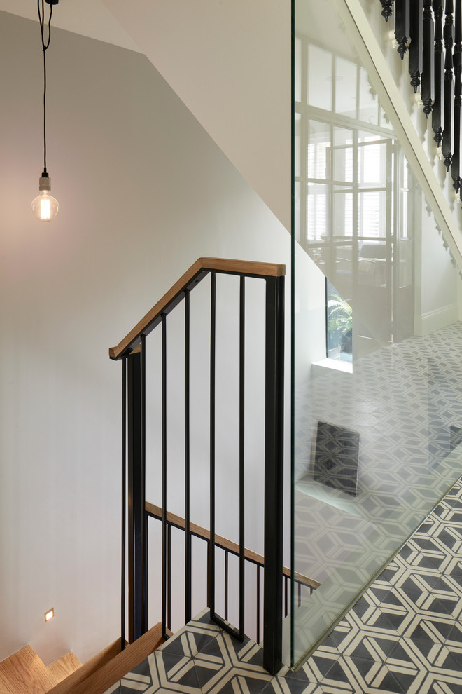 Inspiration for a contemporary hallway in London with concrete floors.