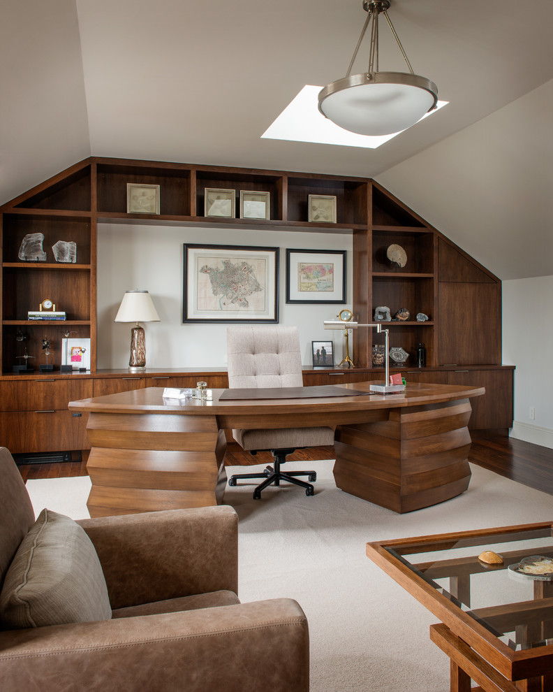 This is an example of a traditional home office in San Francisco with white walls, dark hardwood floors, a freestanding desk and beige floor.