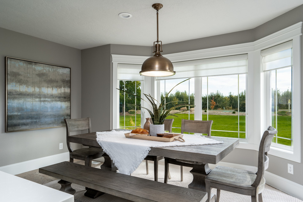 Transitional u-shaped travertine floor and brown floor great room photo in Seattle with an undermount sink, raised-panel cabinets, white cabinets, quartz countertops, white backsplash, porcelain backsplash, stainless steel appliances, an island and white countertops