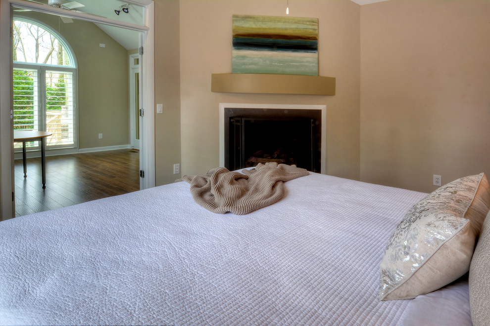 This is an example of a transitional bedroom in Charlotte.