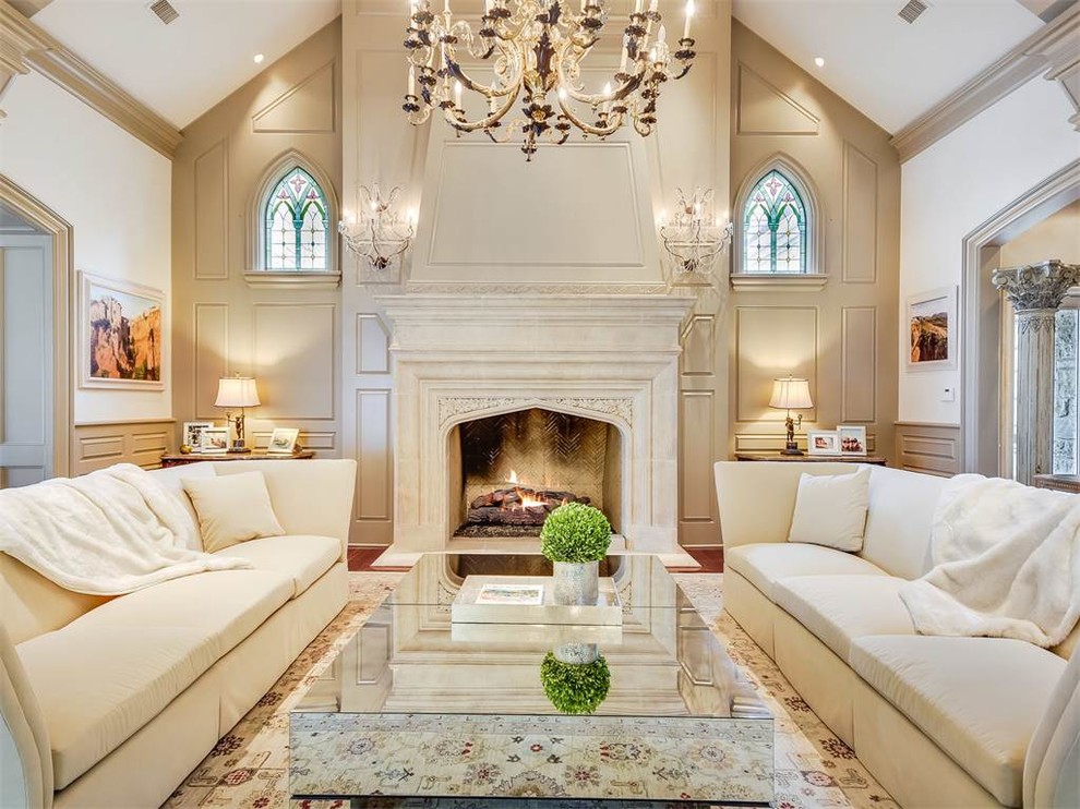 This is an example of a mid-sized traditional formal enclosed living room in Austin with beige walls, medium hardwood floors, a standard fireplace, no tv, brown floor and a stone fireplace surround.