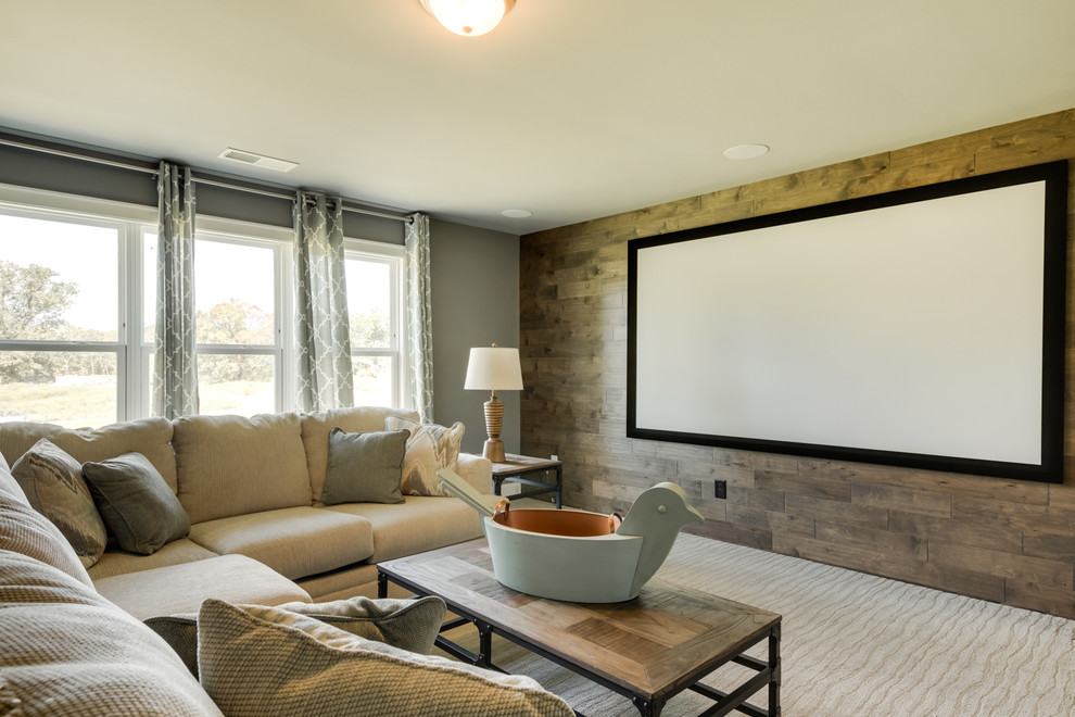 Design ideas for a mid-sized transitional enclosed home theatre in Other with grey walls, carpet, a projector screen and grey floor.