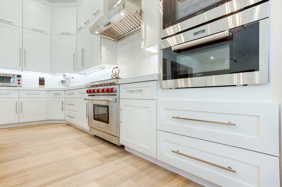 Open concept kitchen - large transitional galley open concept kitchen idea in Phoenix with shaker cabinets and an island