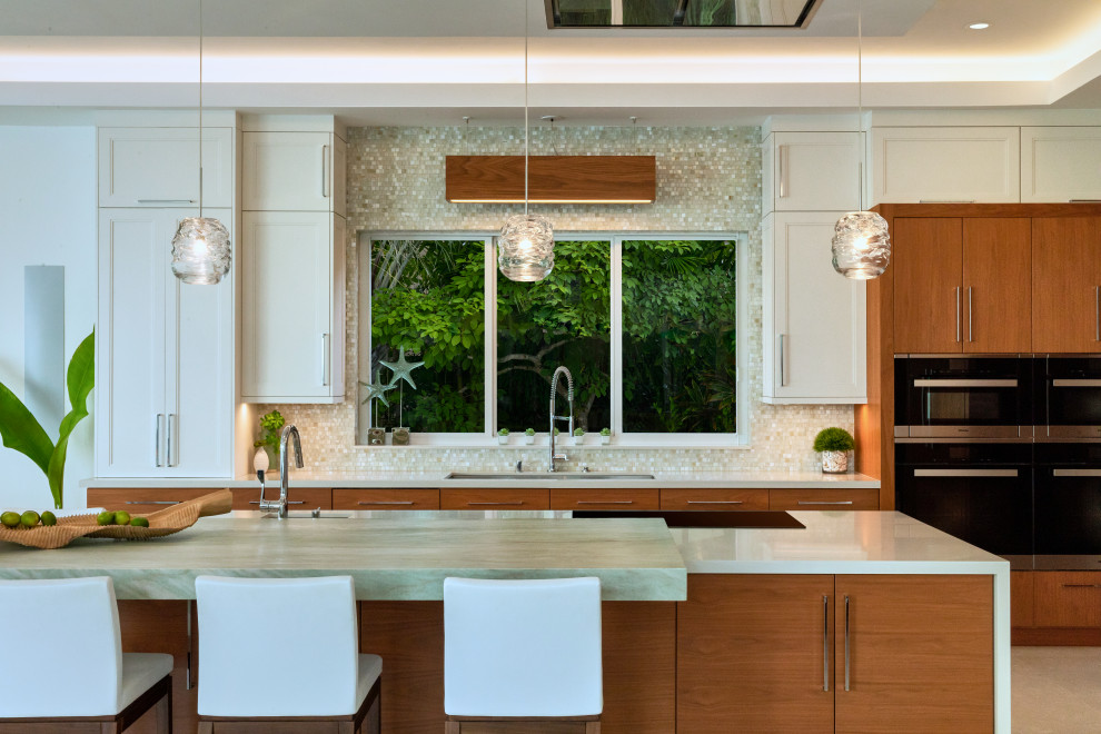 Photo of a large tropical kitchen in Miami.