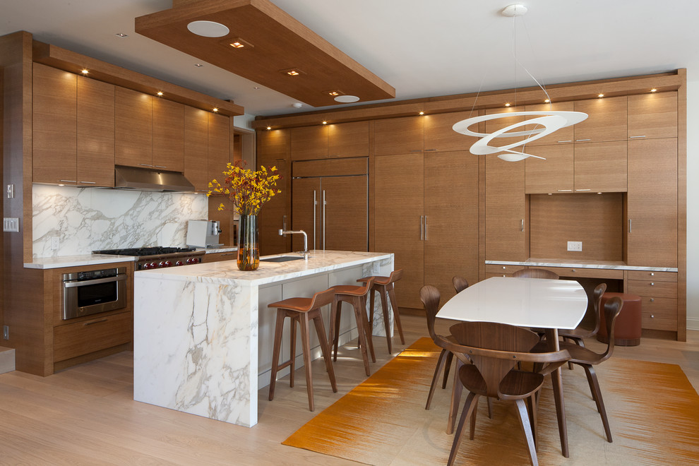 Large 1950s l-shaped light wood floor eat-in kitchen photo in Toronto with brown walls, a single-bowl sink, flat-panel cabinets, medium tone wood cabinets, marble countertops, gray backsplash, stone slab backsplash, stainless steel appliances and an island