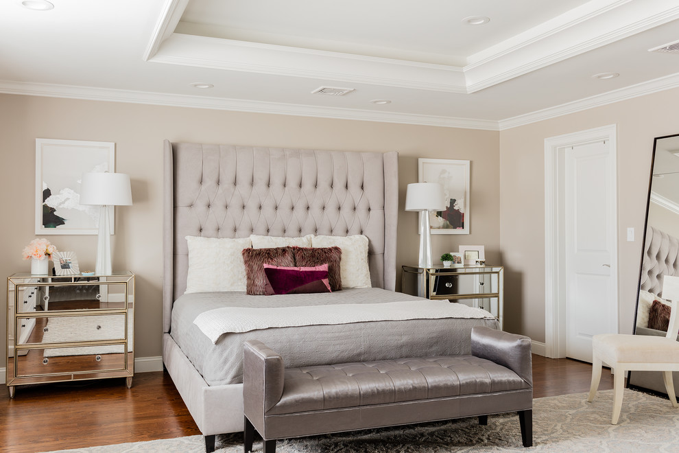 Inspiration for a large traditional master bedroom in Boston with beige walls and medium hardwood floors.