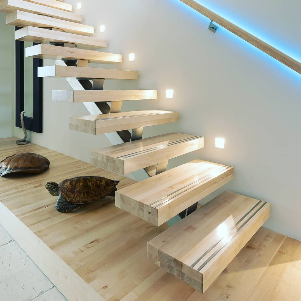Inspiration for a mid-sized industrial wooden straight staircase remodel in Moscow with wooden risers