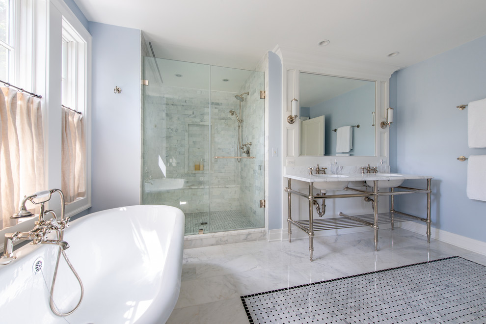 Photo of a large beach style master bathroom in Baltimore with an alcove shower, gray tile, blue walls, ceramic floors, multi-coloured floor, a hinged shower door and white benchtops.