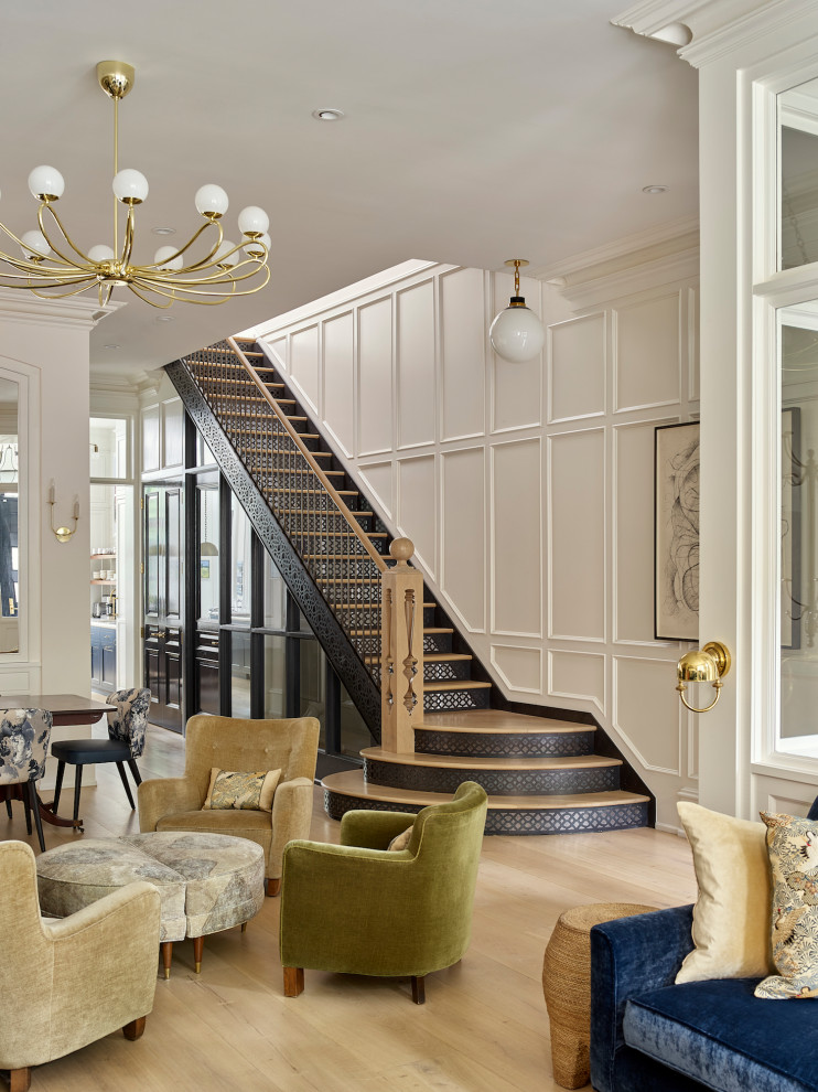 This is an example of a transitional wood straight staircase in Philadelphia with mixed railing and panelled walls.