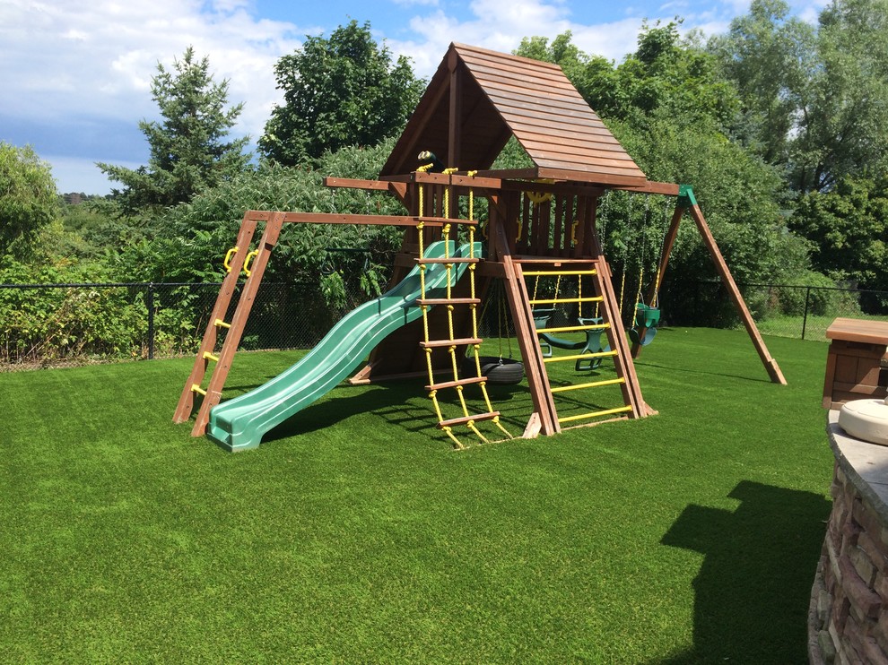 This is an example of a large transitional partial sun and drought-tolerant backyard outdoor playset in Toronto for summer.