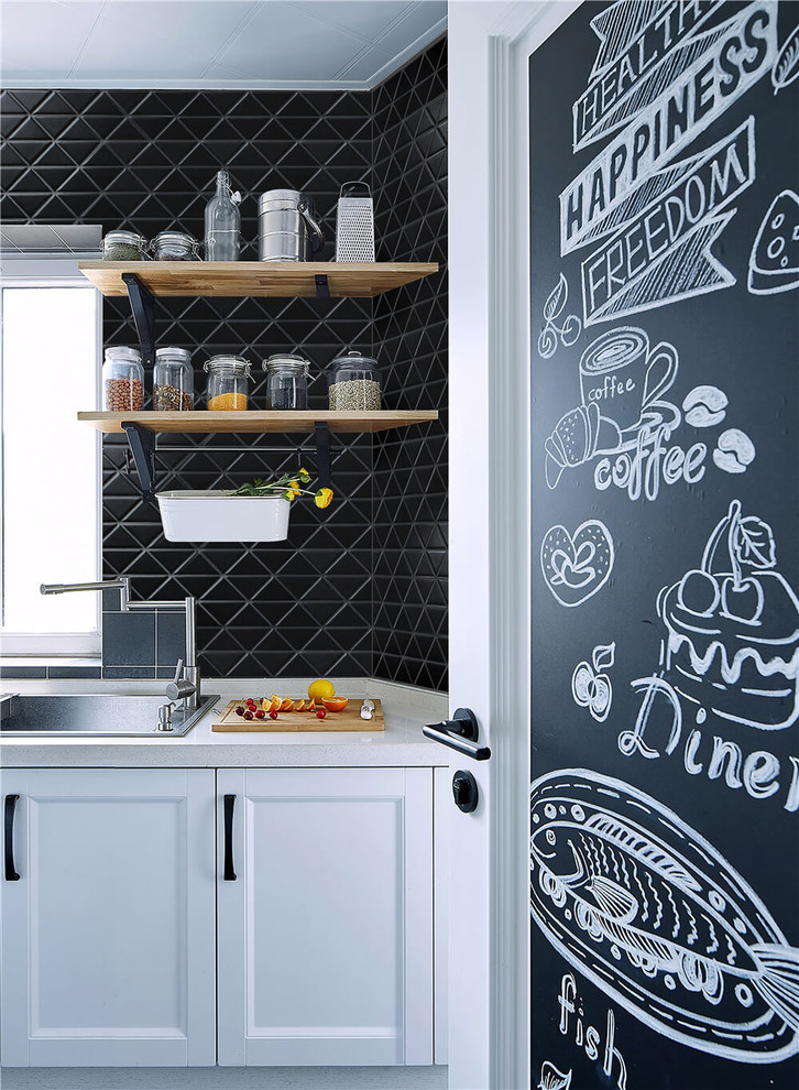 Design ideas for a modern eat-in kitchen in Orange County with black splashback and porcelain splashback.