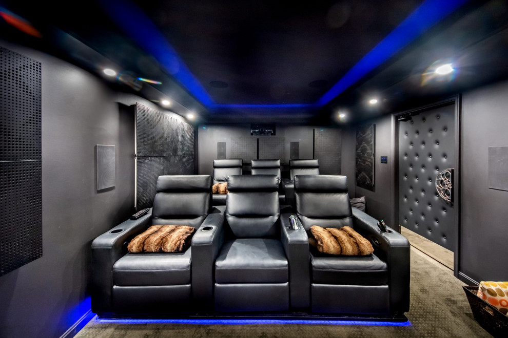 Mid-sized transitional enclosed carpeted and brown floor home theater photo in DC Metro with black walls and a projector screen