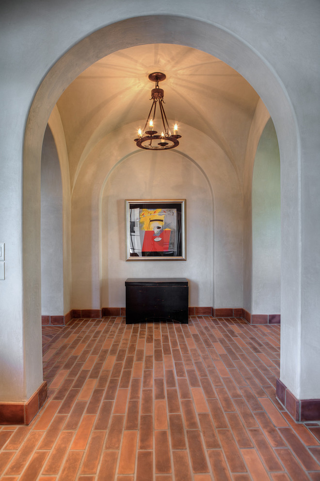 Photo of a mediterranean hallway in Austin with grey walls.