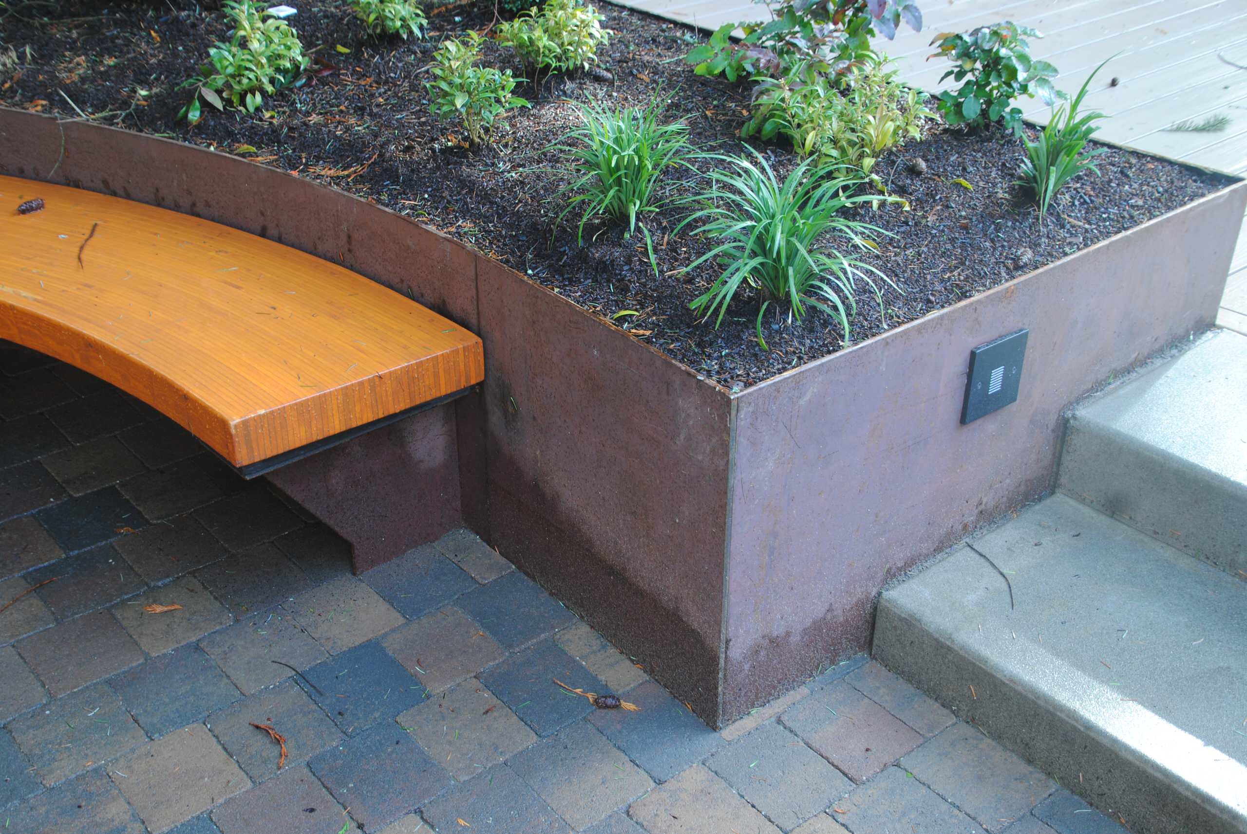 Fire court with steps, planter, bench