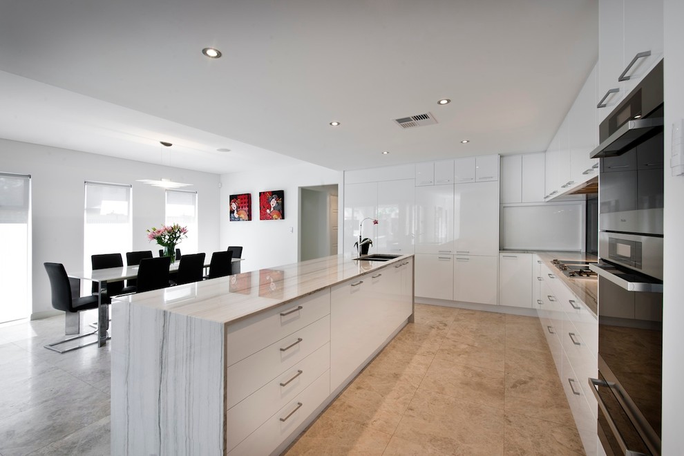 Mid-sized modern u-shaped open plan kitchen in Perth with a double-bowl sink, flat-panel cabinets, white cabinets, granite benchtops, black splashback, glass sheet splashback, stainless steel appliances, marble floors and with island.