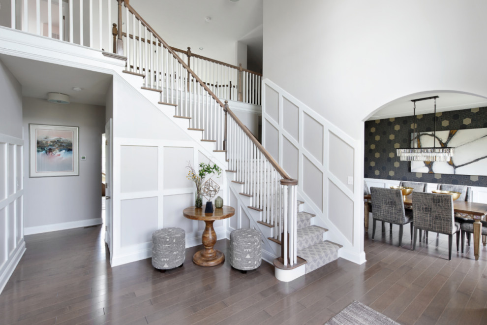 Inspiration for a large contemporary foyer in Philadelphia with grey walls, light hardwood floors, a double front door, a medium wood front door, grey floor and wood walls.