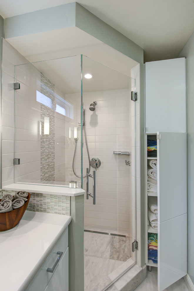 Inspiration for a mid-sized contemporary master bathroom in San Francisco with flat-panel cabinets, white cabinets, engineered quartz benchtops, white tile and porcelain tile.