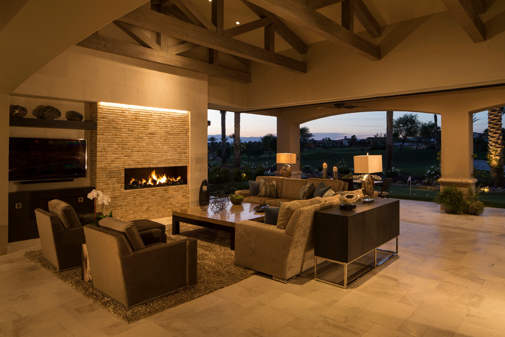 Inspiration for a large transitional backyard stone patio remodel with a gazebo