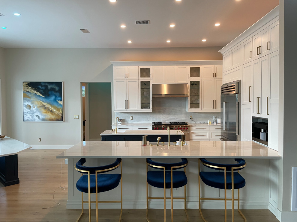 Photo of a mid-sized contemporary l-shaped eat-in kitchen in Miami with multiple islands.