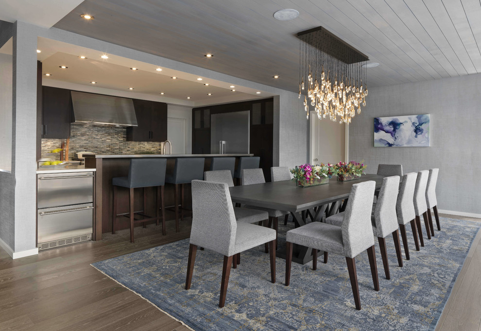 This is an example of a mid-sized contemporary kitchen/dining combo in Burlington with grey walls, light hardwood floors, beige floor and no fireplace.