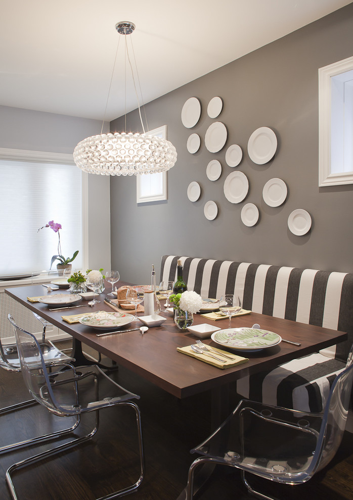 Inspiration for a transitional dining room in Toronto with grey walls, dark hardwood floors and brown floor.