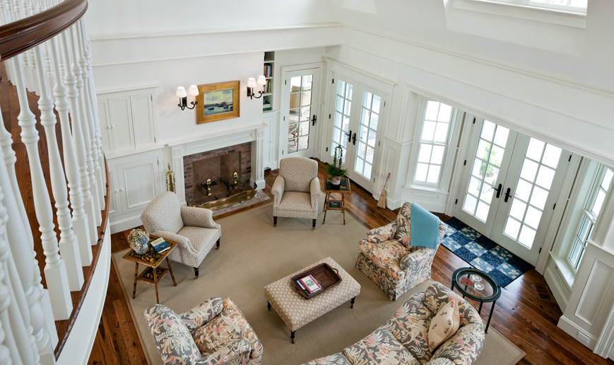 Inspiration for a large beach style formal open concept living room in Boston with white walls, medium hardwood floors, a standard fireplace and a brick fireplace surround.