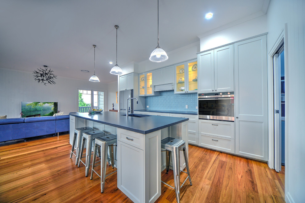 Inspiration for a large traditional kitchen in Brisbane with an undermount sink, shaker cabinets, soapstone benchtops, mosaic tile splashback, medium hardwood floors and with island.