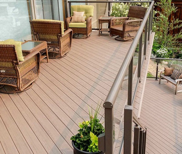 Mid-sized transitional backyard deck photo in Cedar Rapids with a roof extension