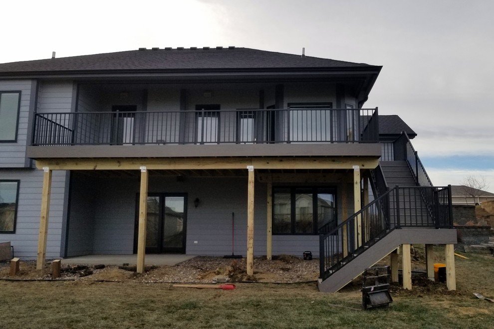 Inspiration for a large backyard deck remodel with no cover