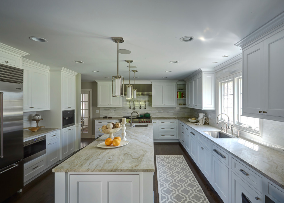 Large transitional u-shaped dark wood floor eat-in kitchen photo in Chicago with an undermount sink, white cabinets, white backsplash, stainless steel appliances, an island, shaker cabinets, soapstone countertops and matchstick tile backsplash