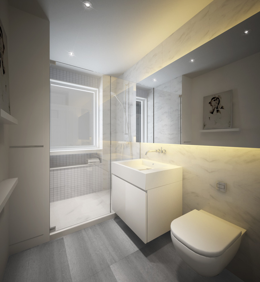 Mid-sized modern master bathroom in New York with a wall-mount sink, flat-panel cabinets, white cabinets, solid surface benchtops, an open shower, a one-piece toilet, white tile, stone tile, white walls and travertine floors.