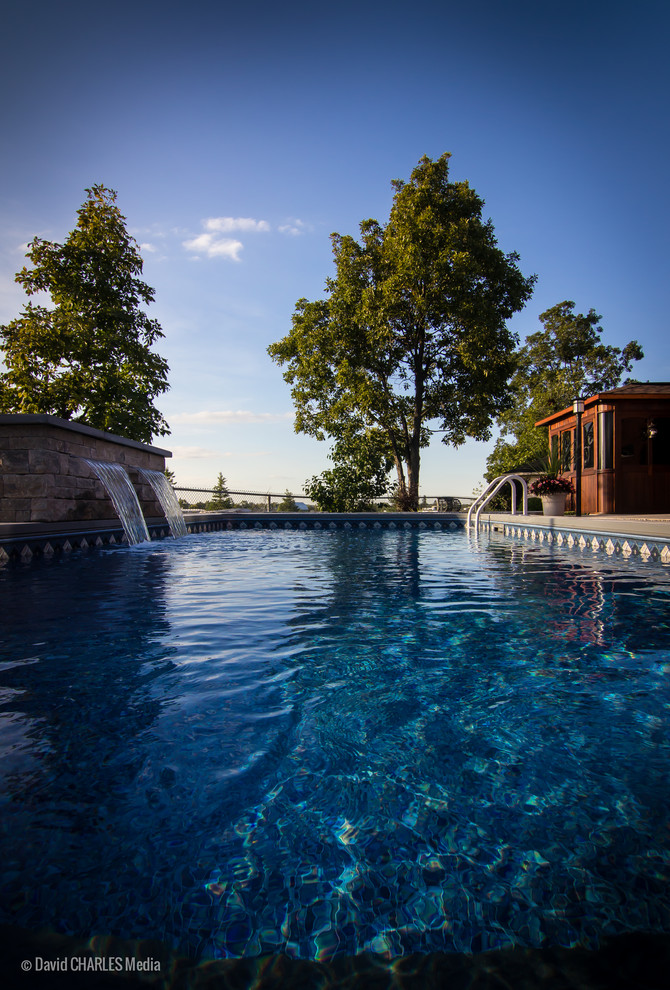 Example of a small transitional backyard concrete and rectangular pool fountain design in Toronto