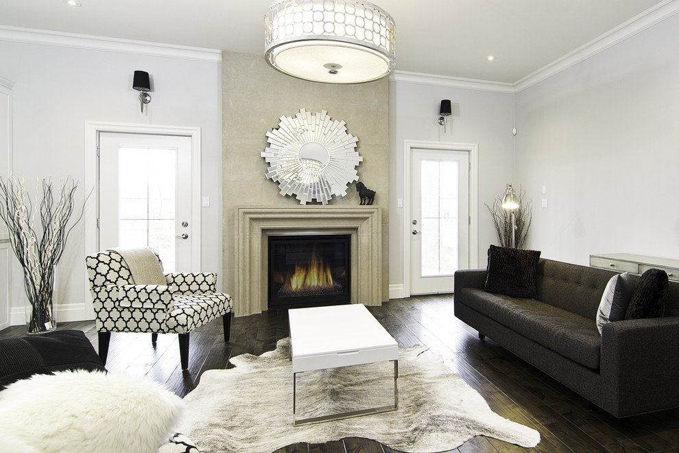 Photo of an eclectic living room in Other with a stone fireplace surround and white walls.